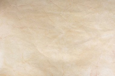 Aged paper sheet. Blank old background with dust and dirty stains. Vintage and antique art concept. Poster mockup. Detailed closeup studio shot. Front view. Toned