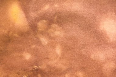 Aged paper sheet. Blank old background with dust and dirty stains. Vintage and antique art concept. Poster mockup. Detailed closeup studio shot. Front view. Toned