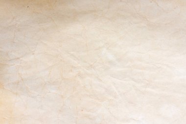 Aged paper sheet. Blank old background with dust and dirty stains. Vintage and antique art concept. Poster mockup. Detailed closeup studio shot. Front view. Toned