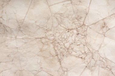 Aged paper sheet. Blank old background with dust and dirty stains. Vintage and antique art concept. Poster mockup. Detailed closeup studio shot. Front view. Toned