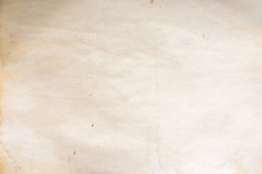 Aged paper sheet. Blank old background with dust and dirty stains. Vintage and antique art concept. Poster mockup. Detailed closeup studio shot. Front view. Toned