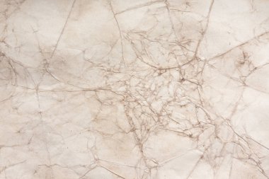 Aged paper sheet. Blank old background with dust and dirty stains. Vintage and antique art concept. Poster mockup. Detailed closeup studio shot. Front view. Toned