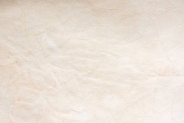 Aged paper sheet. Blank old background with dust and dirty stains. Vintage and antique art concept. Poster mockup. Detailed closeup studio shot. Front view. Toned