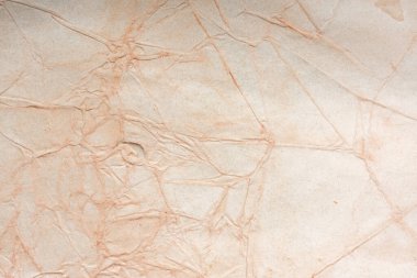 Aged paper sheet. Blank old background with dust and dirty stains. Vintage and antique art concept. Poster mockup. Detailed closeup studio shot. Front view. Toned