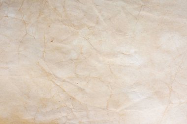 Aged paper sheet. Blank old background with dust and dirty stains. Vintage and antique art concept. Poster mockup. Detailed closeup studio shot. Front view. Toned