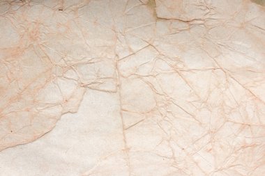 Aged paper sheet. Blank old background with dust and dirty stains. Vintage and antique art concept. Poster mockup. Detailed closeup studio shot. Front view. Toned