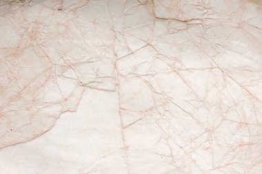 Aged paper sheet. Blank old background with dust and dirty stains. Vintage and antique art concept. Poster mockup. Detailed closeup studio shot. Front view. Toned