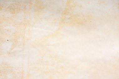 Aged paper sheet. Blank old background with dust and dirty stains. Vintage and antique art concept. Poster mockup. Detailed closeup studio shot. Front view. Toned