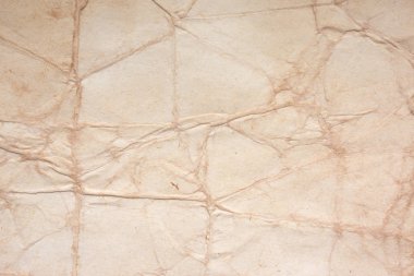 Aged paper sheet. Blank old background with dust and dirty stains. Vintage and antique art concept. Poster mockup. Detailed closeup studio shot. Front view. Toned