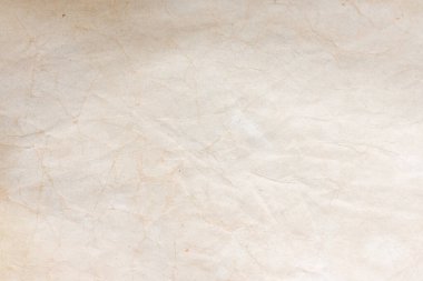 Aged paper sheet. Blank old background with dust and dirty stains. Vintage and antique art concept. Poster mockup. Detailed closeup studio shot. Front view. Toned