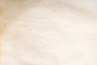 Aged paper sheet. Blank old background with dust and dirty stains. Vintage and antique art concept. Poster mockup. Detailed closeup studio shot. Front view. Toned