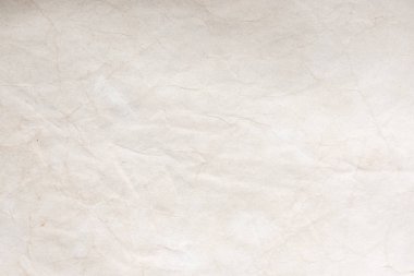 Aged paper sheet. Blank old background with dust and dirty stains. Vintage and antique art concept. Poster mockup. Detailed closeup studio shot. Front view. Toned