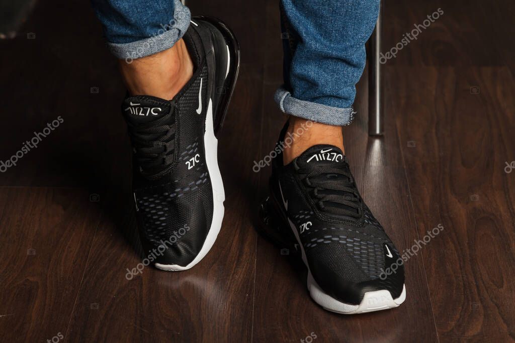 New beautiful colorful and nice Nike Air Max running shoes, sneakers, trainers shows the logo with a brand box on abstract background. Sport and casual footwear concept. Kyiv, Ukraine-August 26, 2018