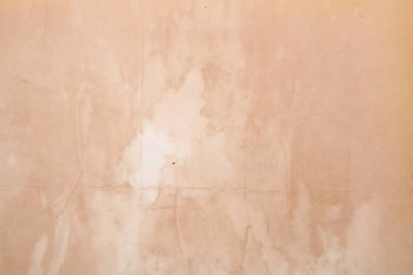 Boş eski kağıt çarşaf. Eski toprak ve kirli lekelerle dolu bir arka plan. Eski ve antika sanat konsepti. Karton, taş, beton ya da doğal mermer gibi bir doku. Poster modeli. 