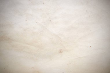 Eski kağıt çarşaf. Toz ve kirli lekelerle dolu boş bir arka plan. Eski ve antika sanat konsepti. Ayrıntılı yakın çekim stüdyo çekimi. Ön manzara. Ayarlanmış