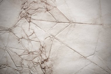 Eski kağıt çarşaf. Toz ve kirli lekelerle dolu boş bir arka plan. Eski ve antika sanat konsepti. Ayrıntılı yakın çekim stüdyo çekimi. Ön manzara. Ayarlanmış