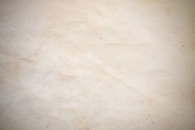 Eski kağıt çarşaf. Toz ve kirli lekelerle dolu boş bir arka plan. Eski ve antika sanat konsepti. Ayrıntılı yakın çekim stüdyo çekimi. Ön manzara. Ayarlanmış