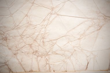 Eski kağıt çarşaf. Toz ve kirli lekelerle dolu boş bir arka plan. Eski ve antika sanat konsepti. Ayrıntılı yakın çekim stüdyo çekimi. Ön manzara. Ayarlanmış