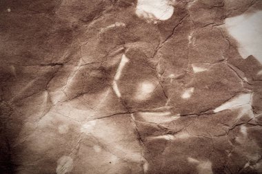 Eski kağıt çarşaf. Toz ve kirli lekelerle dolu boş bir arka plan. Eski ve antika sanat konsepti. Ayrıntılı yakın çekim stüdyo çekimi. Ön manzara. Ayarlanmış