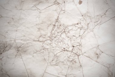 Eski kağıt çarşaf. Toz ve kirli lekelerle dolu boş bir arka plan. Eski ve antika sanat konsepti. Ayrıntılı yakın çekim stüdyo çekimi. Ön manzara. Ayarlanmış