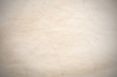 Eski kağıt çarşaf. Toz ve kirli lekelerle dolu boş bir arka plan. Eski ve antika sanat konsepti. Ayrıntılı yakın çekim stüdyo çekimi. Ön manzara. Ayarlanmış