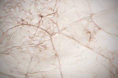 Eski kağıt çarşaf. Toz ve kirli lekelerle dolu boş bir arka plan. Eski ve antika sanat konsepti. Ayrıntılı yakın çekim stüdyo çekimi. Ön manzara. Ayarlanmış