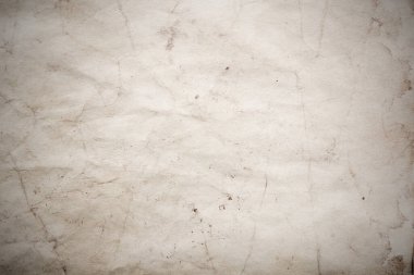 Eski kağıt çarşaf. Toz ve kirli lekelerle dolu boş bir arka plan. Eski ve antika sanat konsepti. Ayrıntılı yakın çekim stüdyo çekimi. Ön manzara. Ayarlanmış