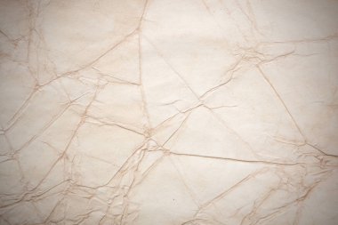 Eski kağıt çarşaf. Toz ve kirli lekelerle dolu boş bir arka plan. Eski ve antika sanat konsepti. Ayrıntılı yakın çekim stüdyo çekimi. Ön manzara. Ayarlanmış