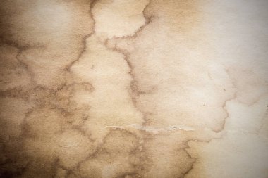 Eski kağıt çarşaf. Toz ve kirli lekelerle dolu boş bir arka plan. Eski ve antika sanat konsepti. Ayrıntılı yakın çekim stüdyo çekimi. Ön manzara. Ayarlanmış