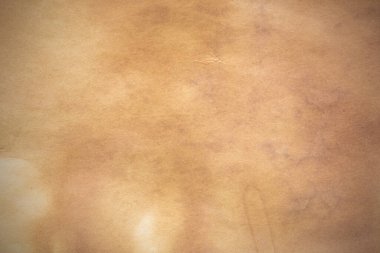 Eski kağıt çarşaf. Toz ve kirli lekelerle dolu boş bir arka plan. Eski ve antika sanat konsepti. Ayrıntılı yakın çekim stüdyo çekimi. Ön manzara. Ayarlanmış