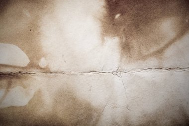 Eski kağıt çarşaf. Toz ve kirli lekelerle dolu boş bir arka plan. Eski ve antika sanat konsepti. Ayrıntılı yakın çekim stüdyo çekimi. Ön manzara. Ayarlanmış