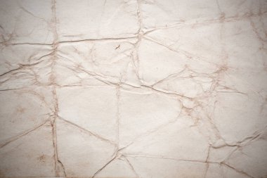 Eski kağıt çarşaf. Toz ve kirli lekelerle dolu boş bir arka plan. Eski ve antika sanat konsepti. Ayrıntılı yakın çekim stüdyo çekimi. Ön manzara. Ayarlanmış