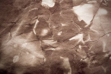 Eski kağıt çarşaf. Toz ve kirli lekelerle dolu boş bir arka plan. Eski ve antika sanat konsepti. Ayrıntılı yakın çekim stüdyo çekimi. Ön manzara. Ayarlanmış