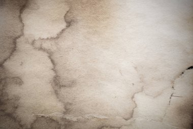 Eski kağıt çarşaf. Toz ve kirli lekelerle dolu boş bir arka plan. Eski ve antika sanat konsepti. Ayrıntılı yakın çekim stüdyo çekimi. Ön manzara. Ayarlanmış