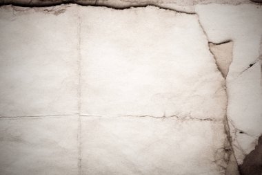 Eski kağıt çarşaf. Toz ve kirli lekelerle dolu boş bir arka plan. Eski ve antika sanat konsepti. Ayrıntılı yakın çekim stüdyo çekimi. Ön manzara. Ayarlanmış