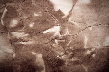 Eski kağıt çarşaf. Toz ve kirli lekelerle dolu boş bir arka plan. Eski ve antika sanat konsepti. Ayrıntılı yakın çekim stüdyo çekimi. Ön manzara. Ayarlanmış