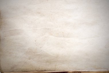 Eski kağıt çarşaf. Toz ve kirli lekelerle dolu boş bir arka plan. Eski ve antika sanat konsepti. Ayrıntılı yakın çekim stüdyo çekimi. Ön manzara. Ayarlanmış