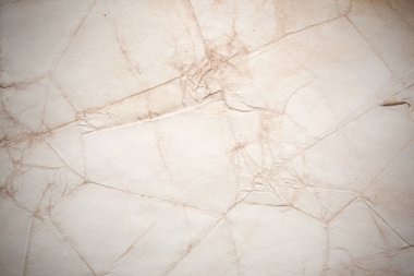 Eski kağıt çarşaf. Toz ve kirli lekelerle dolu boş bir arka plan. Eski ve antika sanat konsepti. Ayrıntılı yakın çekim stüdyo çekimi. Ön manzara. Ayarlanmış