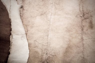 Eski kağıt çarşaf. Toz ve kirli lekelerle dolu boş bir arka plan. Eski ve antika sanat konsepti. Ayrıntılı yakın çekim stüdyo çekimi. Ön manzara. Ayarlanmış