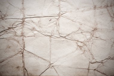 Eski kağıt çarşaf. Toz ve kirli lekelerle dolu boş bir arka plan. Eski ve antika sanat konsepti. Ayrıntılı yakın çekim stüdyo çekimi. Ön manzara. Ayarlanmış