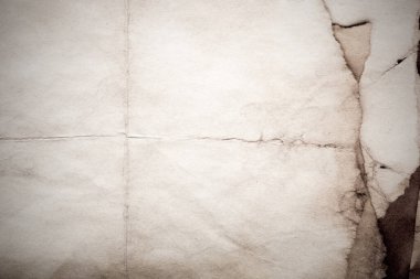 Eski kağıt çarşaf. Toz ve kirli lekelerle dolu boş bir arka plan. Eski ve antika sanat konsepti. Ayrıntılı yakın çekim stüdyo çekimi. Ön manzara. Ayarlanmış