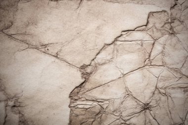 Eski kağıt çarşaf. Toz ve kirli lekelerle dolu boş bir arka plan. Eski ve antika sanat konsepti. Ayrıntılı yakın çekim stüdyo çekimi. Ön manzara. Ayarlanmış