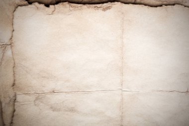 Eski kağıt çarşaf. Toz ve kirli lekelerle dolu boş bir arka plan. Eski ve antika sanat konsepti. Ayrıntılı yakın çekim stüdyo çekimi. Ön manzara. Ayarlanmış