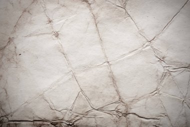 Eski kağıt çarşaf. Toz ve kirli lekelerle dolu boş bir arka plan. Eski ve antika sanat konsepti. Ayrıntılı yakın çekim stüdyo çekimi. Ön manzara. Ayarlanmış