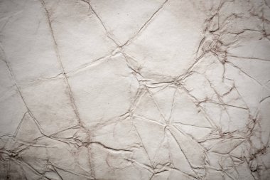 Eski kağıt çarşaf. Toz ve kirli lekelerle dolu boş bir arka plan. Eski ve antika sanat konsepti. Ayrıntılı yakın çekim stüdyo çekimi. Ön manzara. Ayarlanmış