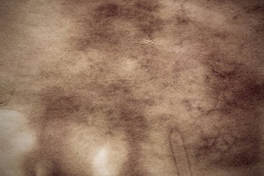 Eski kağıt çarşaf. Toz ve kirli lekelerle dolu boş bir arka plan. Eski ve antika sanat konsepti. Ayrıntılı yakın çekim stüdyo çekimi. Ön manzara. Ayarlanmış