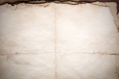 Eski kağıt çarşaf. Toz ve kirli lekelerle dolu boş bir arka plan. Eski ve antika sanat konsepti. Ayrıntılı yakın çekim stüdyo çekimi. Ön manzara. Ayarlanmış