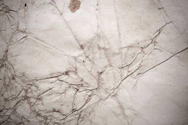 Eski kağıt çarşaf. Toz ve kirli lekelerle dolu boş bir arka plan. Eski ve antika sanat konsepti. Ayrıntılı yakın çekim stüdyo çekimi. Ön manzara. Ayarlanmış