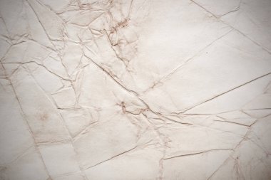 Eski kağıt çarşaf. Toz ve kirli lekelerle dolu boş bir arka plan. Eski ve antika sanat konsepti. Ayrıntılı yakın çekim stüdyo çekimi. Ön manzara. Ayarlanmış