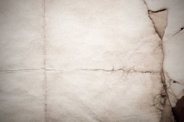 Eski kağıt çarşaf. Toz ve kirli lekelerle dolu boş bir arka plan. Eski ve antika sanat konsepti. Ayrıntılı yakın çekim stüdyo çekimi. Ön manzara. Ayarlanmış